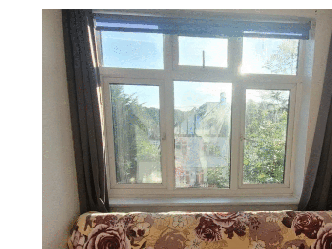 Comfortable double bedroom with essential furniture, heating, and Wi-Fi, perfect for long stays.