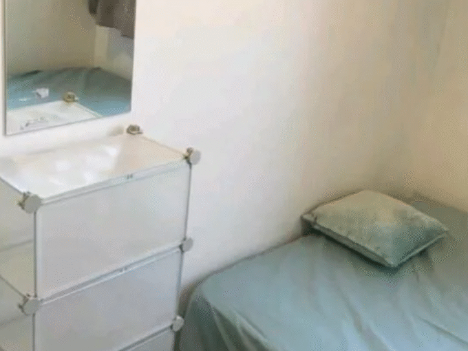 Comfortable double bedroom with essential furniture, heating, and Wi-Fi, perfect for long stays.